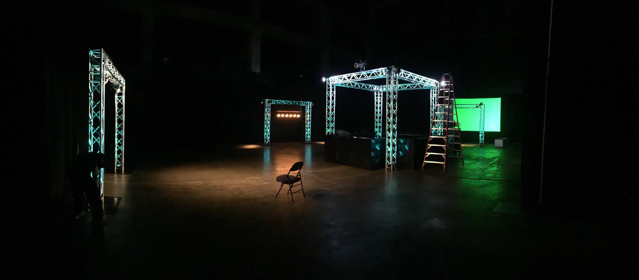Outdoor evening event with cyan stage uplighting in Tennessee