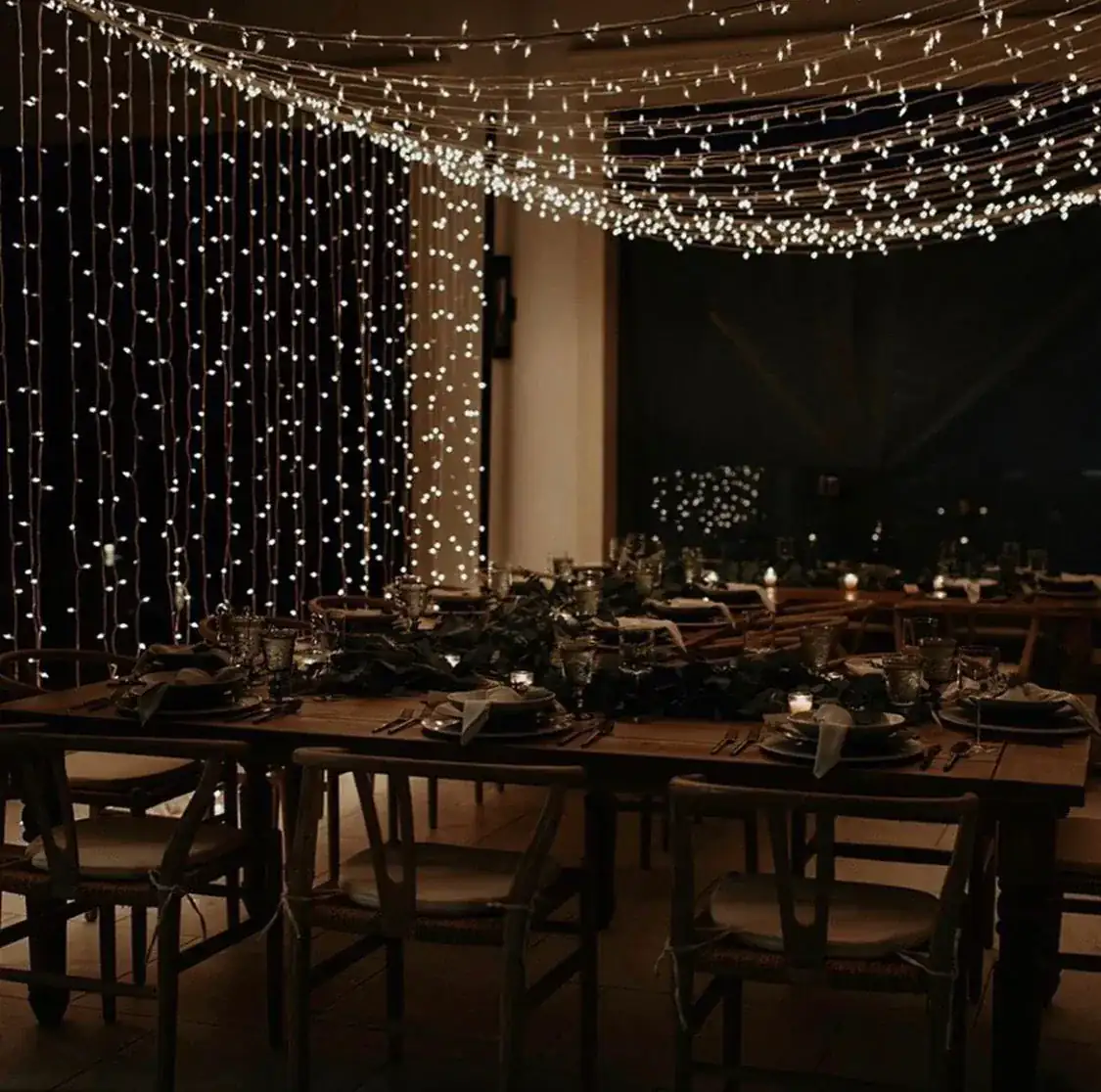 Formal gala dinner with cascading string light installation