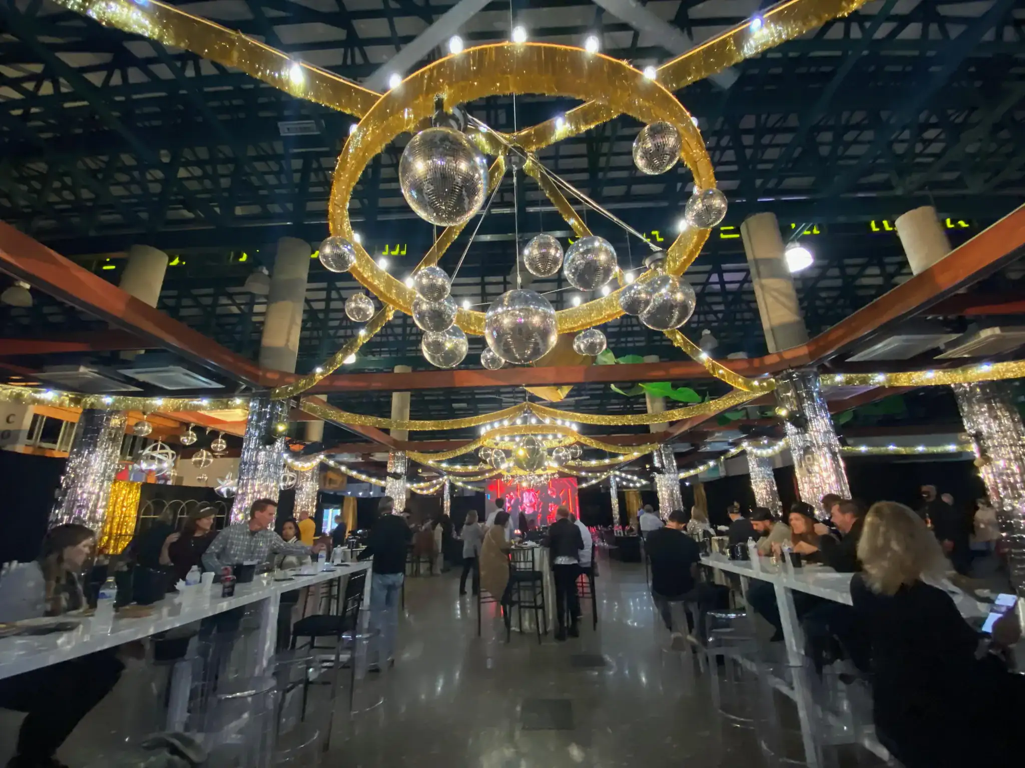 Gala venue with dramatic gold geometric light sculpture