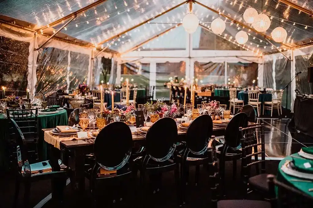 Wedding reception with warm amber uplighting